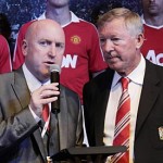 Manchester United's manager Alex Ferguson, right, is interviewed by the voice of Manchester United Alan Keegan in Chicago. (AP Photo/Charles Rex Arbogast)