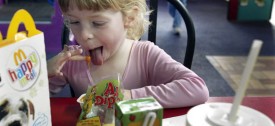 Sarah Bennett, 4, eats a McDonald's Happy Meal in Renton, Wash. (AP Photo/Ted S. Warren, file)