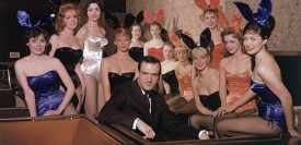 Hugh Hefner, surrounded by a dozen Playboy Bunnies, at the original Chicago Playboy Club in 1960. (Playboy Enterprises)