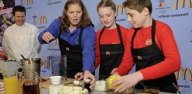 McDonald’s chef Dan Coudreaut looks on as U.S. Olympic Gold Medalist Picabo Street promotes McDonald's new smoothies at the Vancouver Olympics. (McDonald's)