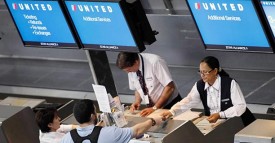 Passengers check in at a United Airlines ticket counter. (AP Photo/Michael Dwyer, file)