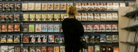 A customer looks at films at a Blockbuster Video store in Los Angeles. (AP Photo/Kevork Djansezian)