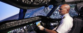 Pilot Gregg Pointon "flies" from the cockpit of a Boeing 787 full-flight simulator. (Elaine Thompson/AP)