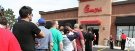 The parking lot at the new Chick-fil-A restaurant in Aurora briefly turned into a campground, with the chain offering the first one hundred people in line a one-year supply of 52 meals coupons on Thursday. (Chuck Berman/Chicago Tribune)