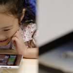 The success of the iPad has put pressure on Motorola and other gadget-makers. (AP Photo/Andy Wong)