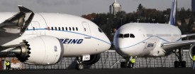 One test model Boeing 787 passes another on the tarmac before a flight from Boeing Field Wednesday, Oct. 27, 2010, in Seattle. (AP Photo/Elaine Thompson)