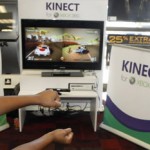 Two boys play the Kinect for XBox 360 at a Charlotte, N.C. Gamestop store, Oct. 31, 2010. (AP Photo/Nell Redmond)