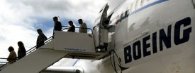 Passengers exit a Boeing 787 Dreamliner aircraft at the Farnborough Airshow in Hampshire, England, July 18, 2010. (Ben Stansall/AFP/Getty Images)