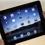 In this photo taken April 3, 2010, a customer uses an Apple iPad on the first day of Apple iPad sales at an Apple store in San Francisco. (AP Photo/Paul Sakuma, File)