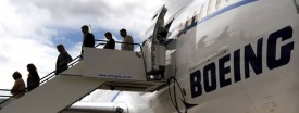 Guests exit a Boeing 787 Dreamliner aircraft at the Farnborough Airshow, Hampshire, July 18, 2010. (Ben Stansall/AFP/Getty Images)
