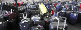 Luggage sitting inside Terminal 8 at JFK International Airport in New York, July 30, 2008. (AP Photo/Rick Maiman)