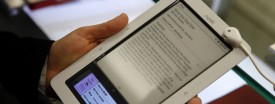 A customer tries out a Nook electronic book reader at a Barnes and Noble. (AP Photo/Seth Wenig)
