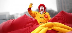 Ronald McDonald waves to the crowd during the 2010 St. Patrick's Day Parade on Columbus Drive. (William DeShazer/Tribune)