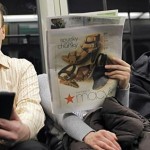 A commuter reads on a Kindle e-reader while riding the subway in Cambridge, Mass. (Reuters/Brian Snyder)